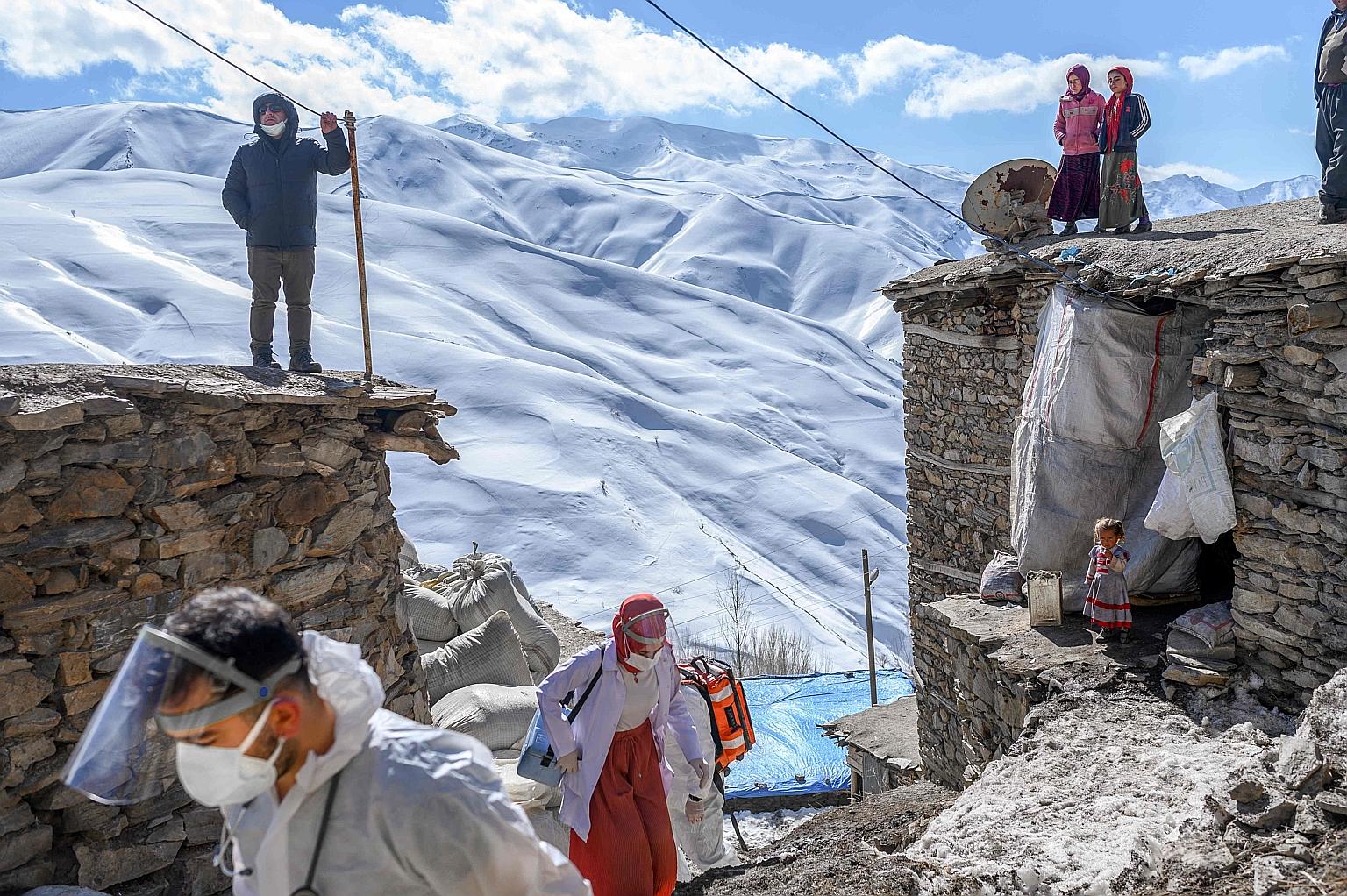 A February photo of medical workers during a campaign to vaccinate the elderly in a village in Turkey. PHOTO: AGENCE FRANCE-PRESSE