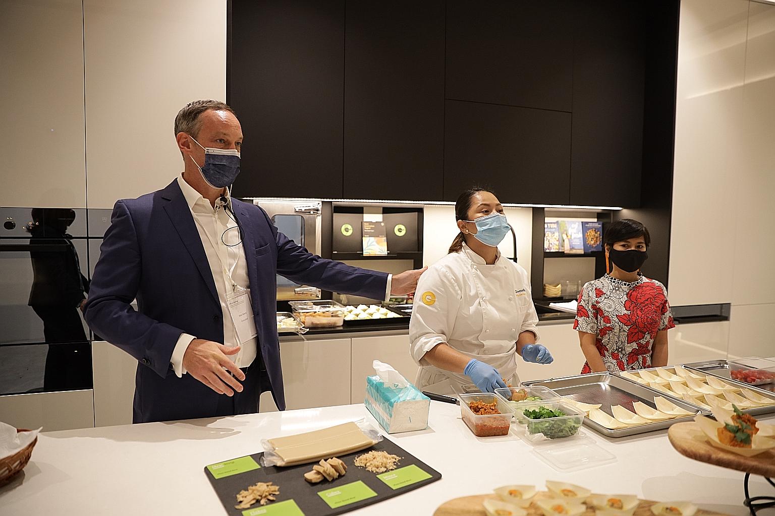 (From far left) Givaudan Taste & Wellbeing's head of regional innovation Alex Ward, chef Marilen Ingco and APAC Savoury & Snacks industry specialist Rinna Medrana showcasing plant-based protein recipes developed and cooked in-house yesterday. PHOTO: 