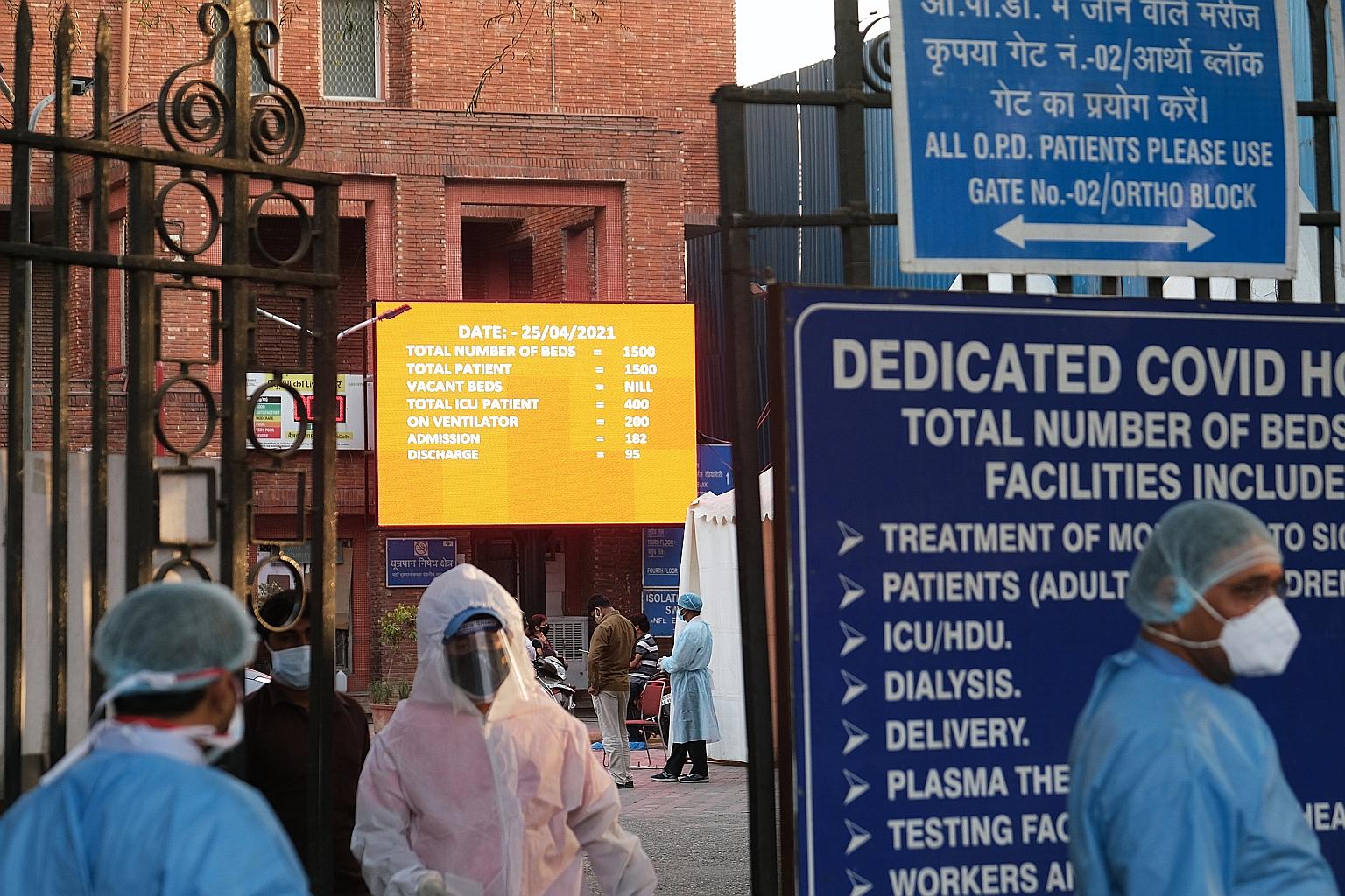 An electronic board indicating that there were no vacant beds at the Lok Nayak Jai Prakash Hospital in New Delhi on Sunday. Some Covid-19 patients have had to recuperate at home due to a shortage of hospital beds. PHOTO: BLOOMBERG