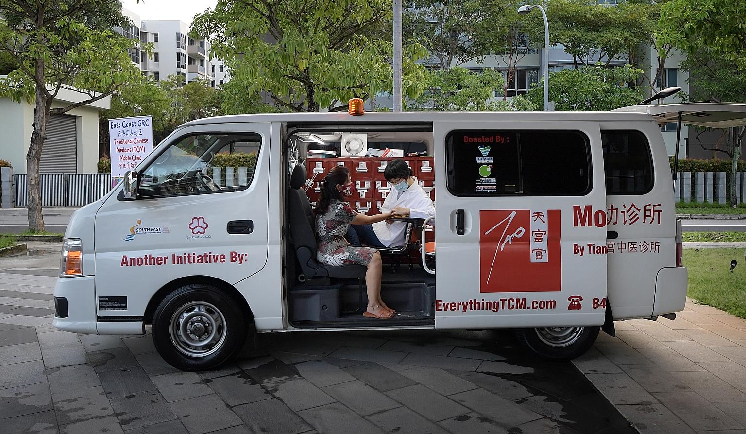 Madam Choo Choi Sim at a consultation with traditional Chinese medicine (TCM) physician Chen Jiayi in the mobile TCM clinic launched yesterday. The clinic will visit about 25 locations in East Coast GRC on a regular basis.