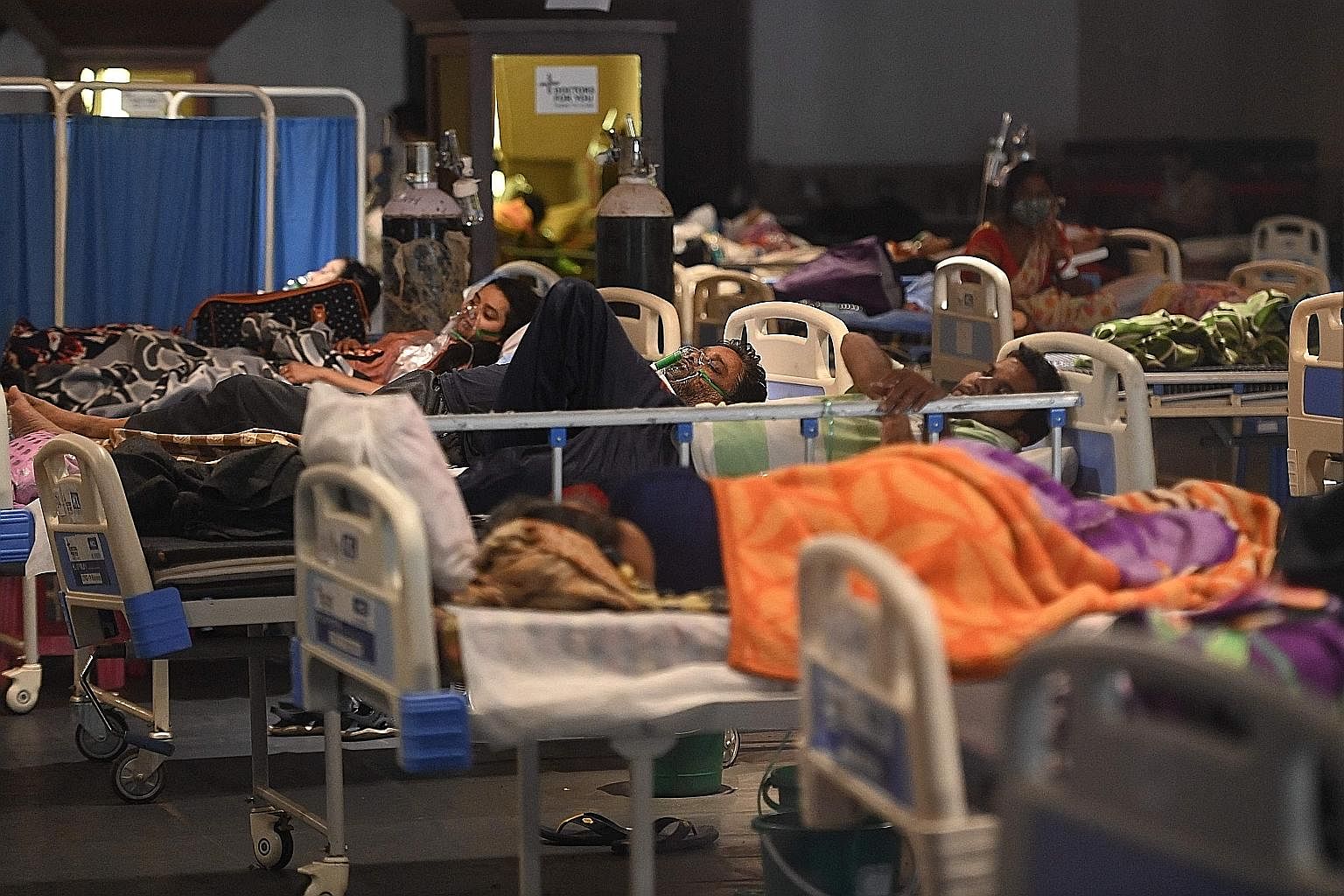 A banquet hall in New Delhi was converted into a Covid-19 treatment facility to help cope with the shortage of hospital beds as India battled a deadly surge in cases yesterday. Amid reports of patients frantically trying to get oxygen cylinders, coun