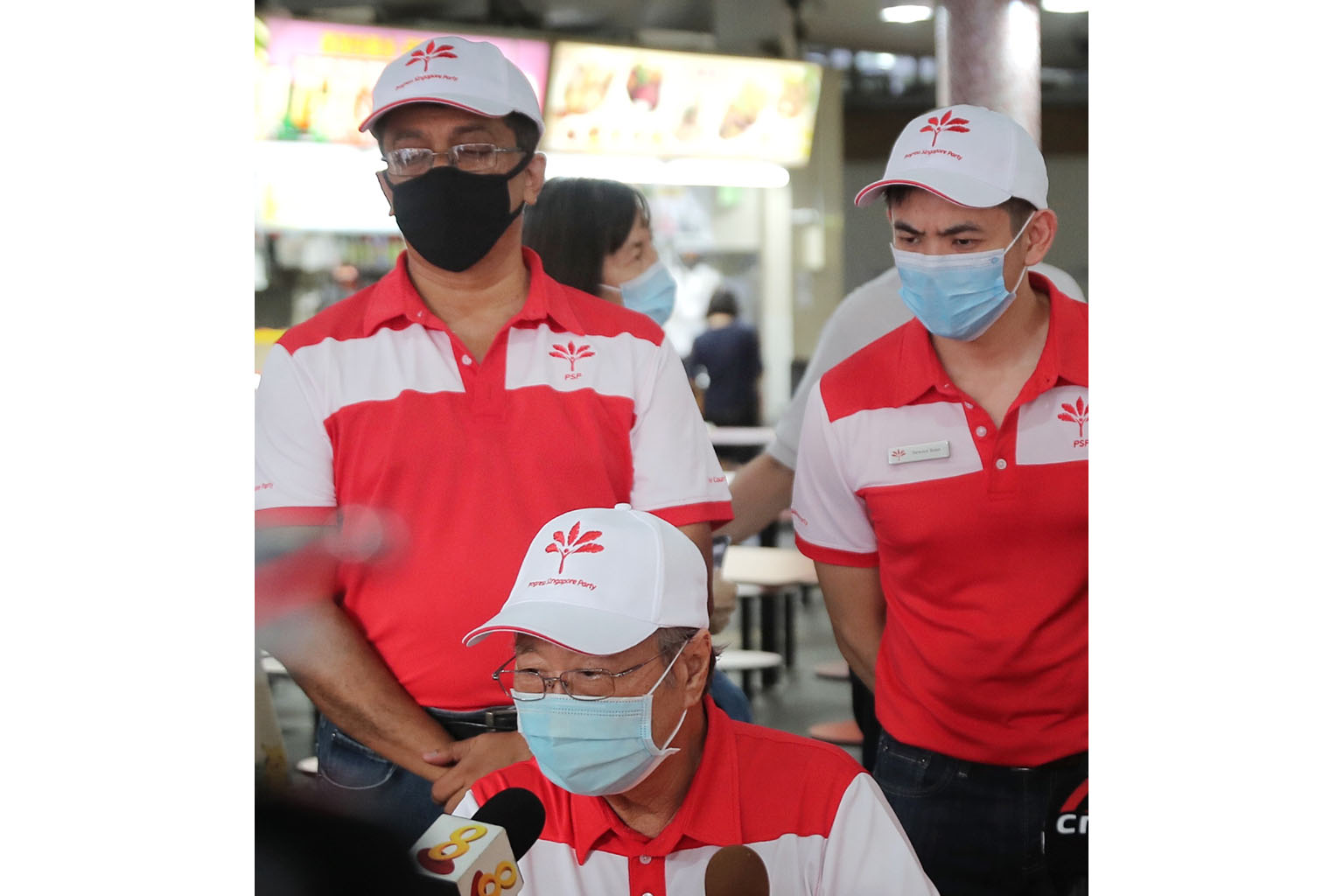 PSP member Terence Soon (at right) with party chairman Tan Cheng Bock (seated) and fellow member Harish Pillay during last year's general election campaign.