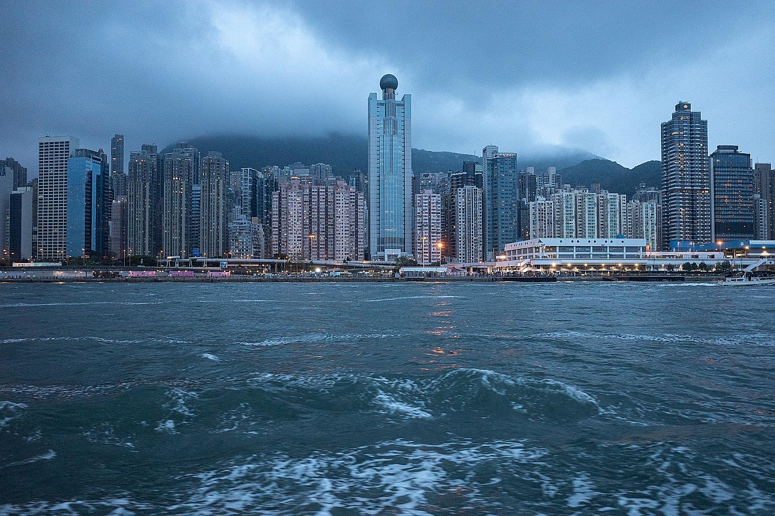 Buildings in Western Town and Kennedy Town districts in Hong Kong. Private property prices in the city rose 0.8 per cent last month, up for the third month in a row. PHOTO: EPA-EFE