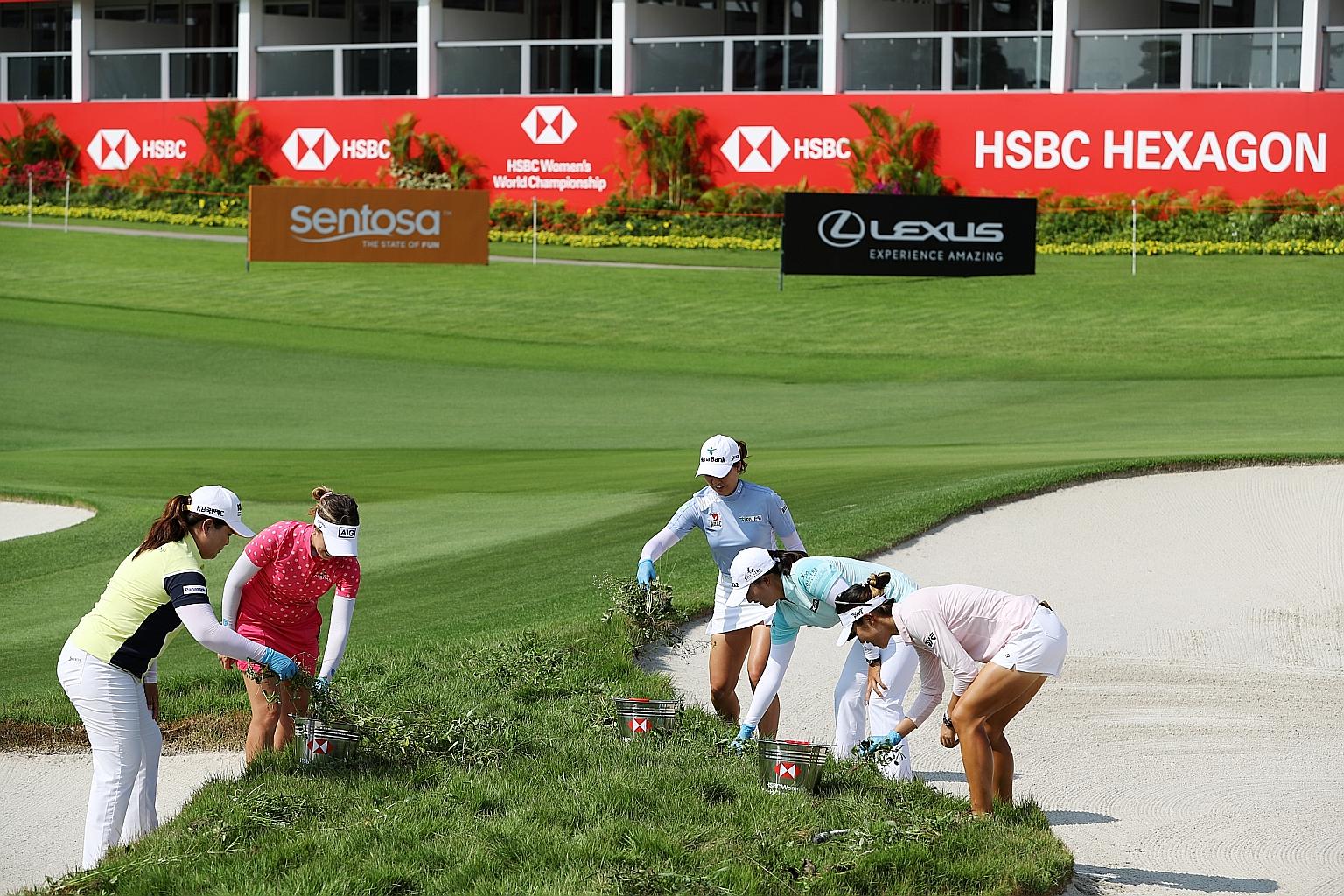 Players competing in this week's HSBC Women's World Championship taking time out to support Sentosa Golf Club's environmental sustainability efforts, which include the hand removal of weeds to minimise the use of pesticides. (From left) Park In-bee o
