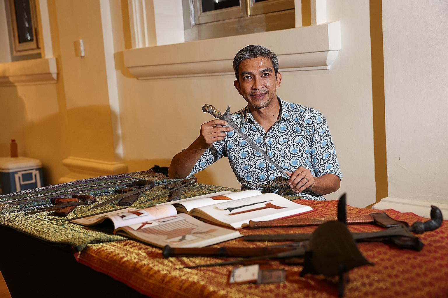 Mr Jamal Mohamad, a programmer at the Malay Heritage Centre, showing his personal kris collection. It will be featured on the festival's website in a video series, one of the programmes that have nothing to do with food or medicine.