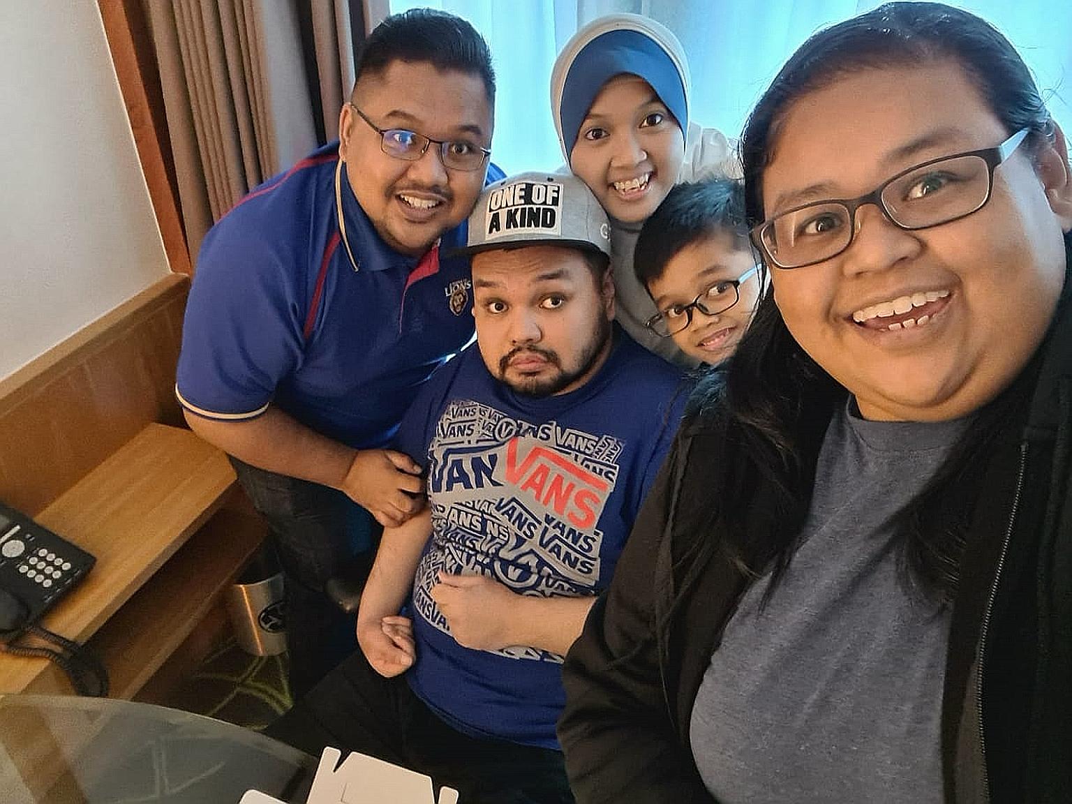 Volunteer Mohamad Syahid Arif (left) with wife Nurul Badariah Percho beside him, son Muhammad Syarif Mohamad Syahid, eight, brother Saiful Azfar Arif and cousin Farhahton Hussin Shah (right).