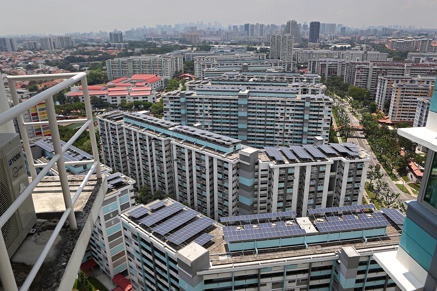 Solar panels on top of HDB blocks. The conference will discuss ways to navigate the challenges and opportunities brought by the energy transition. PHOTO: LIANHE ZAOBAO