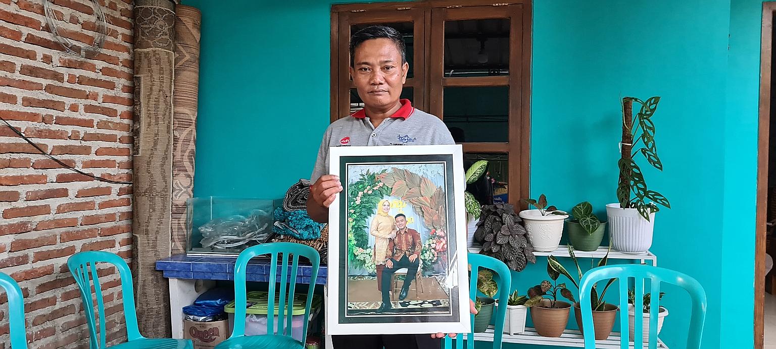 Mr Wahyudi, an army officer whose son Pandu Yudha Kusuma died in the incident, with a photo of his son and daughter-in-law. Amid the grief, he said he was also proud of his son. "For us military officers, to die on duty is an honour... That makes me 