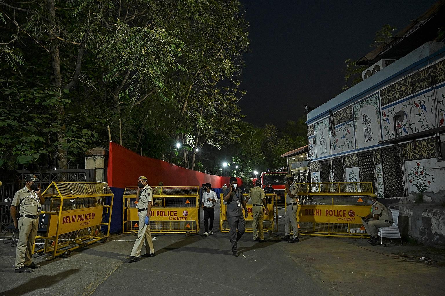 Policemen outside the Arun Jaitley Stadium in New Delhi on Wednesday during an IPL match played behind closed doors. The T20 cricket tournament is held across six venues in a bio-secure bubble.