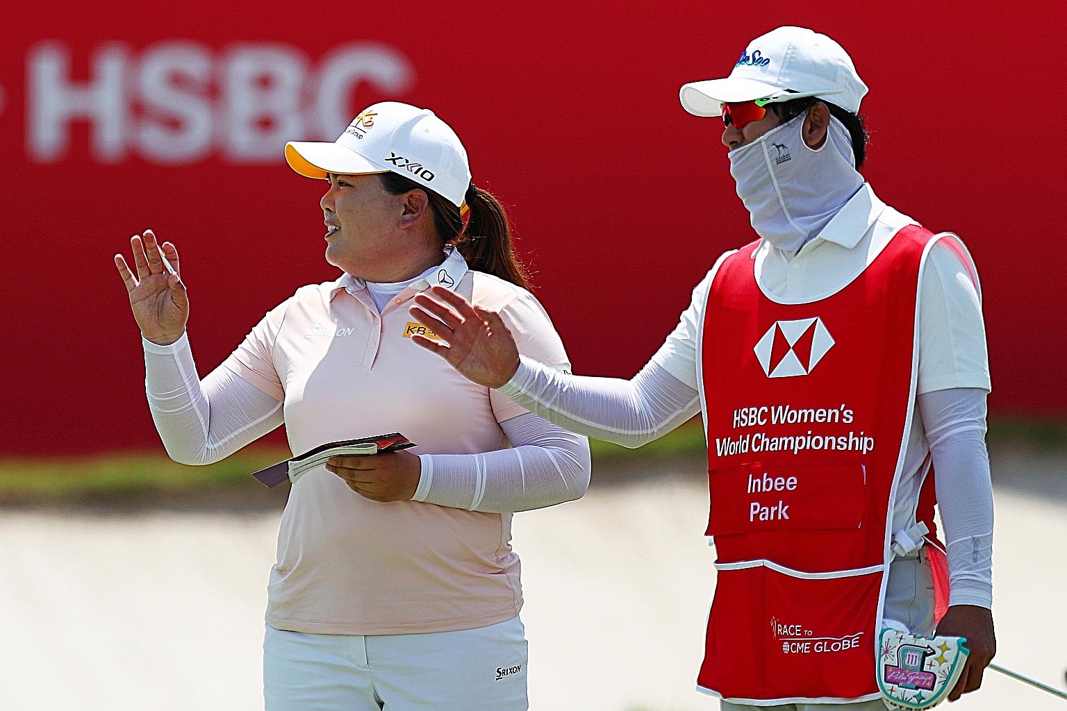 South Korean star Park In-bee, the Rio Olympic champion, with her husband and caddie Nam Gi-hyeob after taking a one-shot first-round lead in the HSBC Women's World Championship. She gave herself a nine but Nam a perfect 10 for carrying her bag in "v