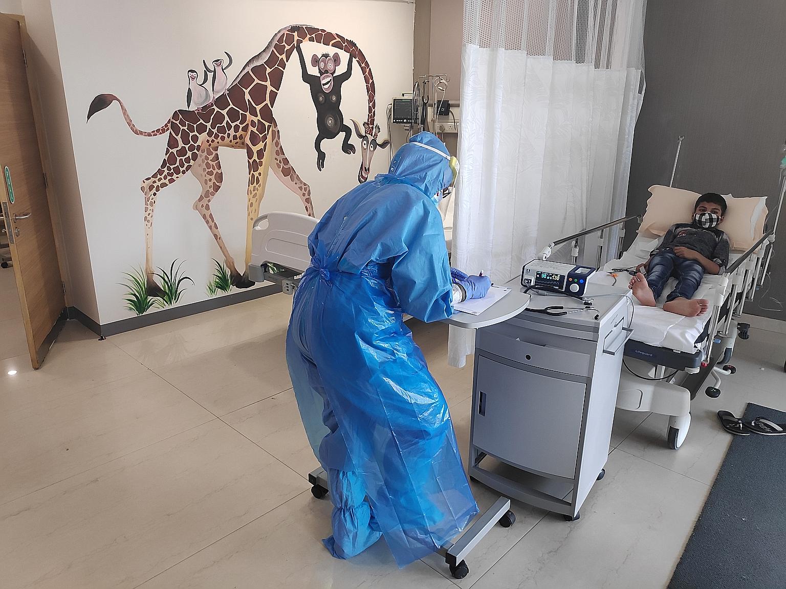 An 11-year-old with fever and severe cough being examined for Covid-19 at a Bangalore hospital's exclusive children's emergency room.