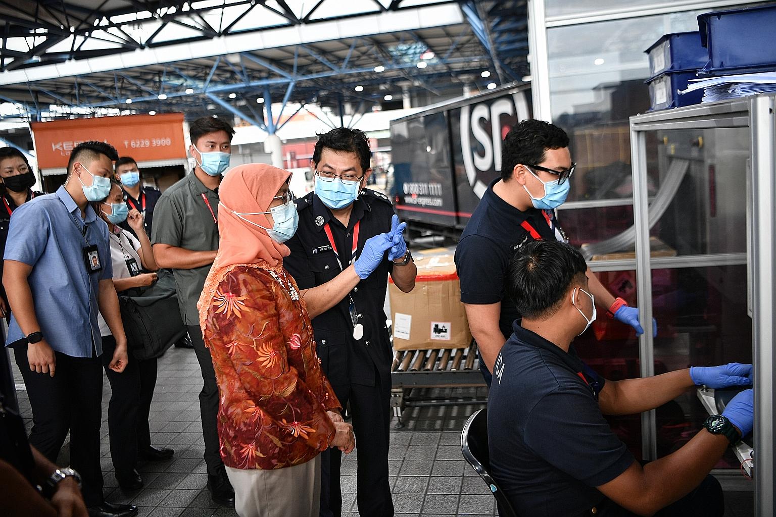 President Halimah Yacob yesterday paid a visit to Changi Airfreight Centre, where she met front-line officers from the Immigration and Checkpoints Authority (ICA) and broke fast with a small group of them. The officers told her that they cleared more