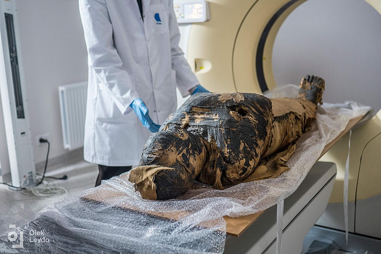 A 2015 photo showing the mummy being prepared for X-ray images at a medical centre in Otwock, near the Polish capital Warsaw.