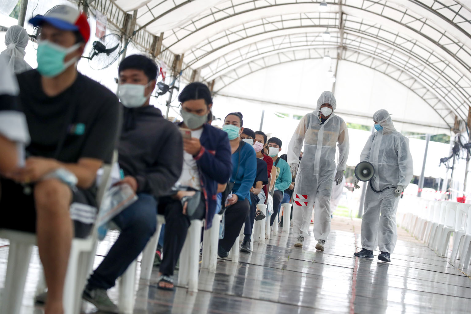 People waiting for their Covid-19 nasal swab tests at the Thai-Japanese Stadium in Bangkok last week. Thailand is set to begin mass inoculations next month.