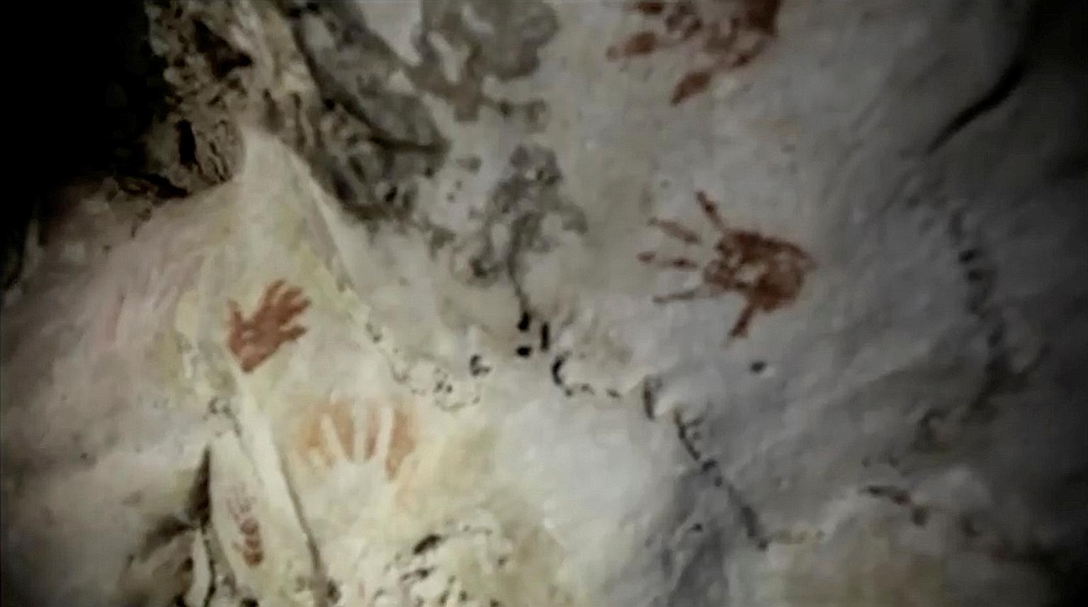 Handprints, reportedly more than 1,200 years old, on the walls of a cave in Mexico, as seen in a screengrab taken from a video. The handprints are believed to be associated with a coming-of-age ritual of the ancient Maya.