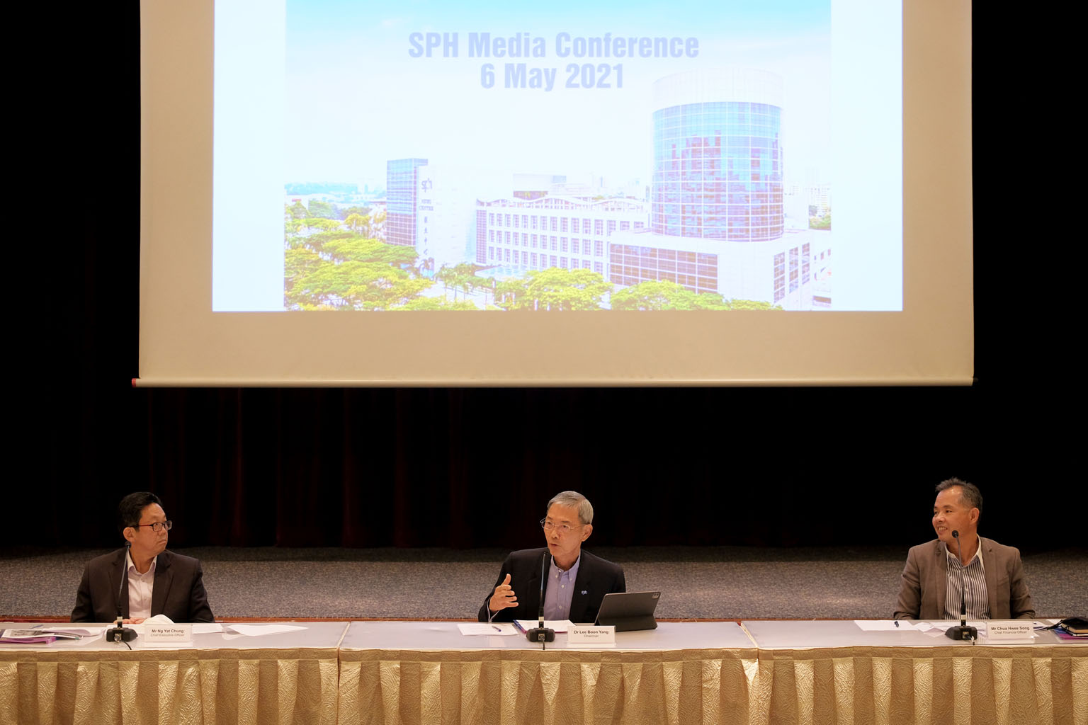 Above: Singapore Press Holdings chairman Lee Boon Yang (centre), with chief executive Ng Yat Chung (left) and chief financial officer Chua Hwee Song at the press conference at News Centre yesterday.