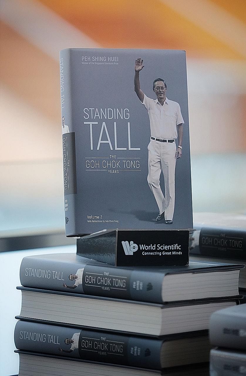 Above: Emeritus Senior Minister Goh Chok Tong (left) with Prime Minister Lee Hsien Loong at the launch of Standing Tall at the National Gallery Singapore yesterday. Below: Standing Tall takes a thematic approach to detailing key moments in Mr Goh's c