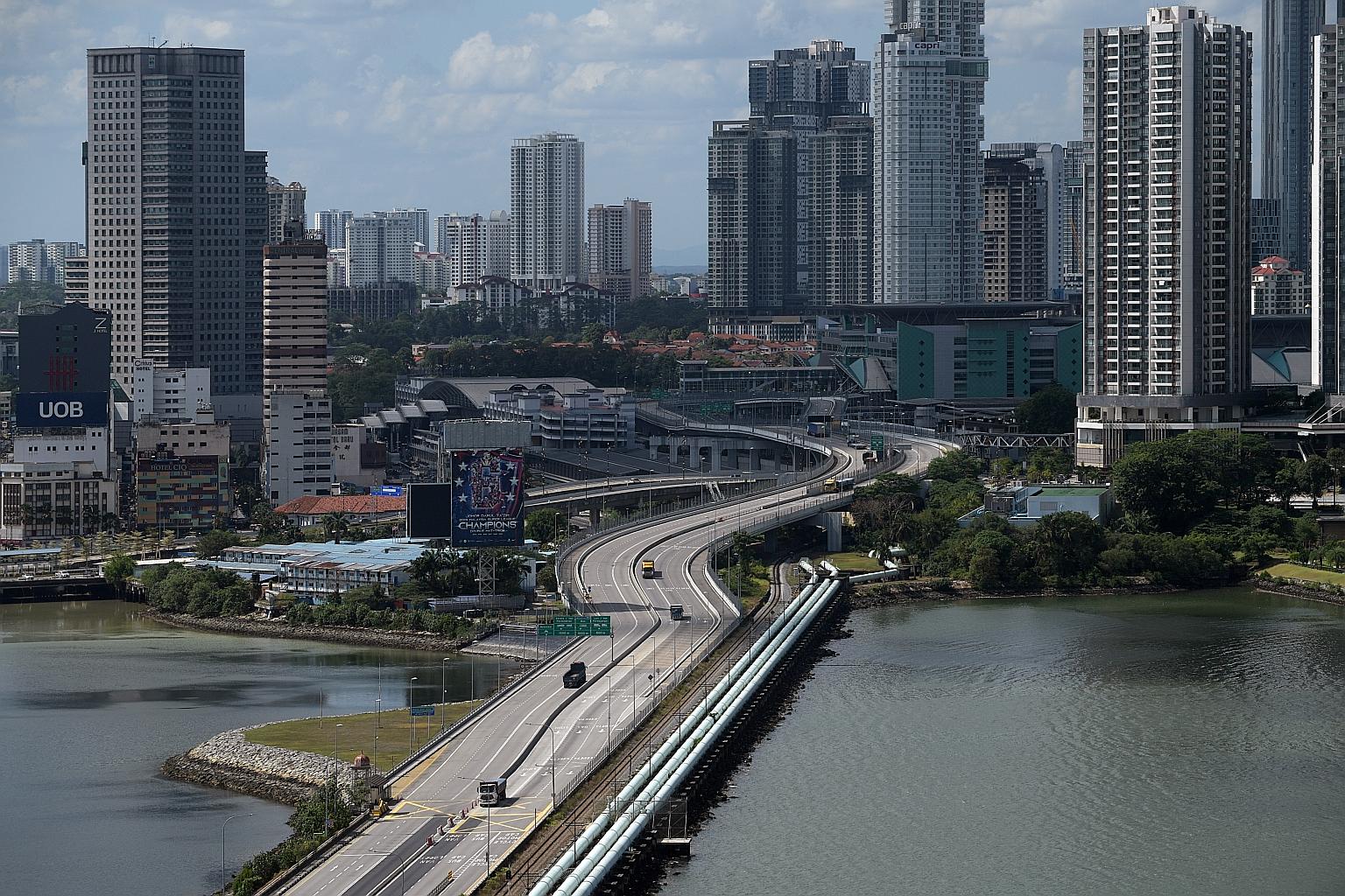 Johor Baru as seen from Woodlands. From yesterday, people from Malaysia and Singapore can apply for cross-border travel to visit family members for emergency reasons such as death or critical illness, with only two visitors per case allowed.