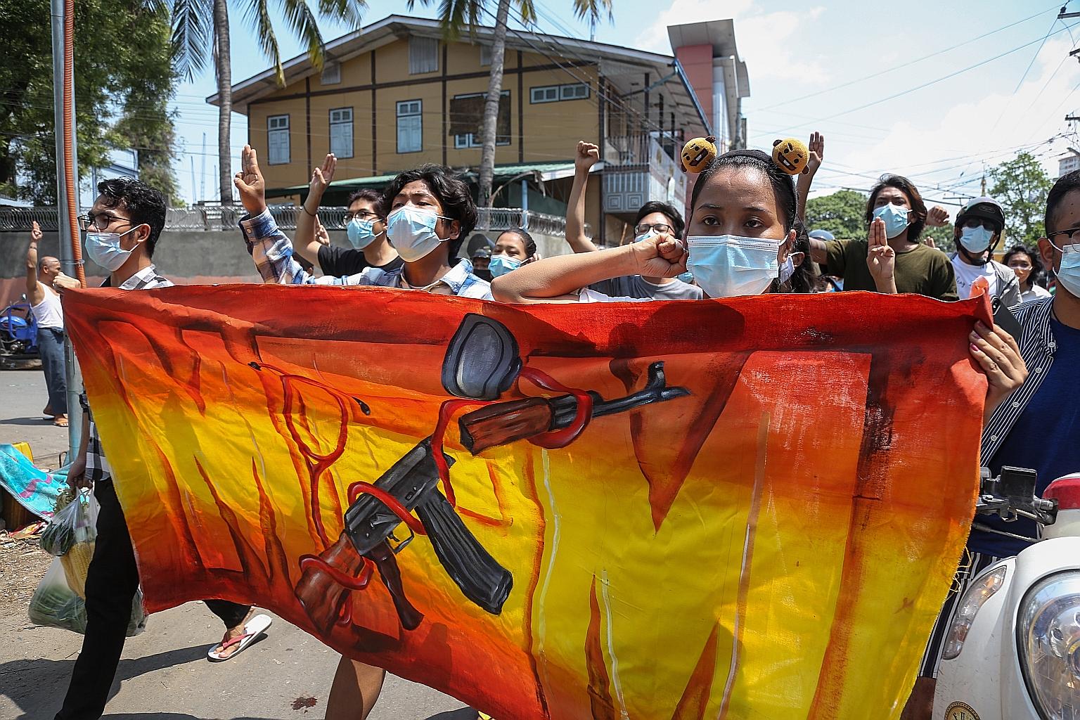 Protesters during an anti-coup march in Mandalay, Myanmar, yesterday. An analyst has played down the prospect of a large-scale urban insurgency in the country, however.