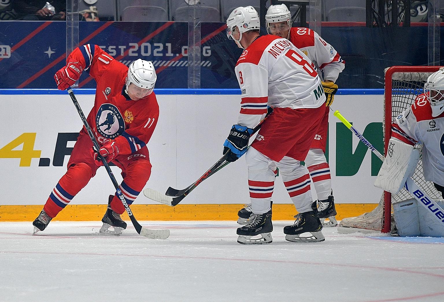 Russian President Vladimir Putin (left) scored nine goals in the Night Hockey League gala match in Sochi on Monday.