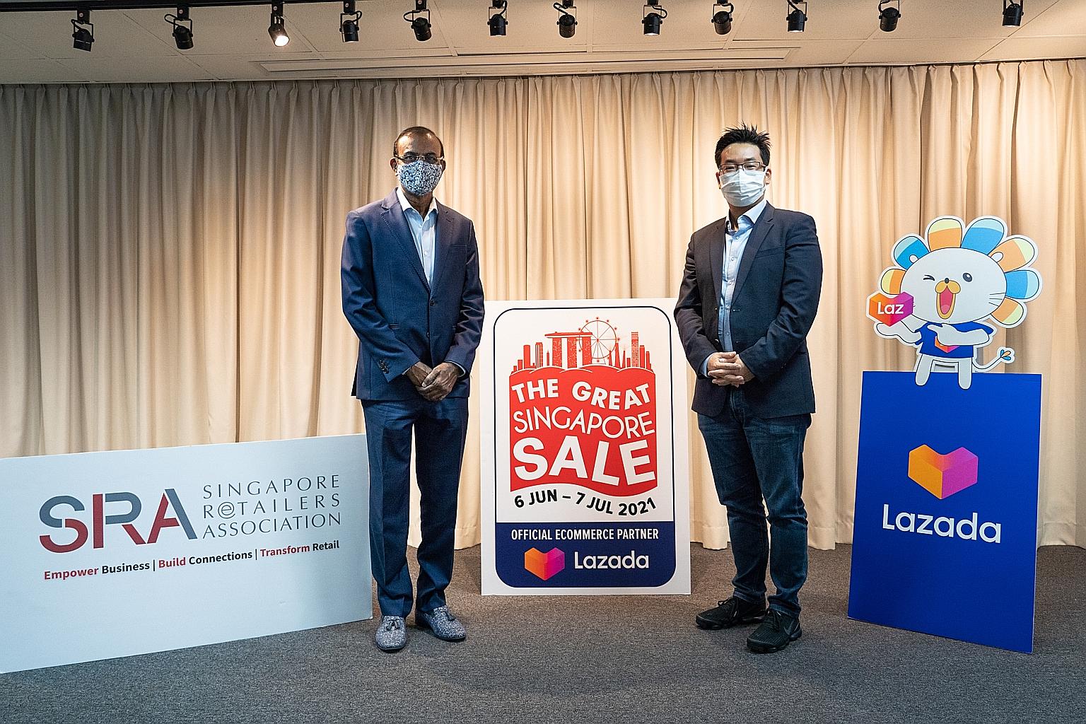 Mr R. Dhinakaran, president of the Singapore Retailers Association, with Mr James Chang, chief executive of Lazada Singapore. The tie-up will help eliminate many of the costly barriers that companies face when selling online. PHOTO: LAZADA SINGAPORE