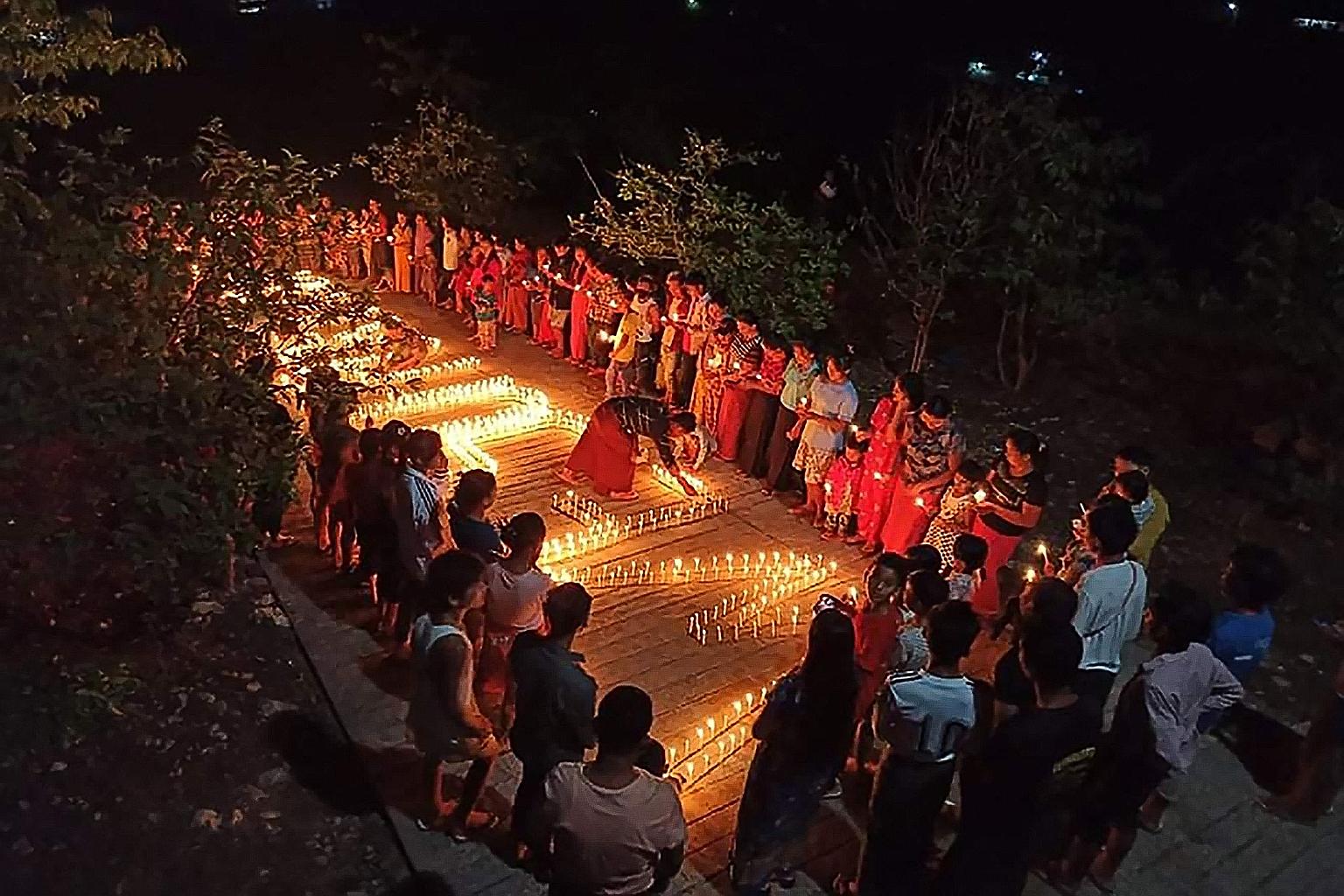 A night-time protest against the military coup in Kachin, Myanmar, on Tuesday. The country is lurching towards state collapse and state failure, an analyst says. PHOTO: AGENCE FRANCE-PRESSE