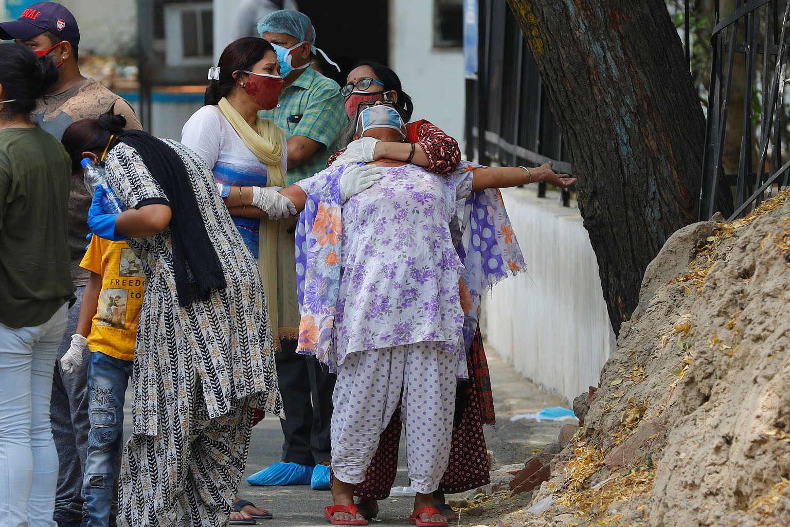 A woman mourning the death of her son, who died from Covid-19, outside the mortuary of a hospital in New Delhi yesterday.