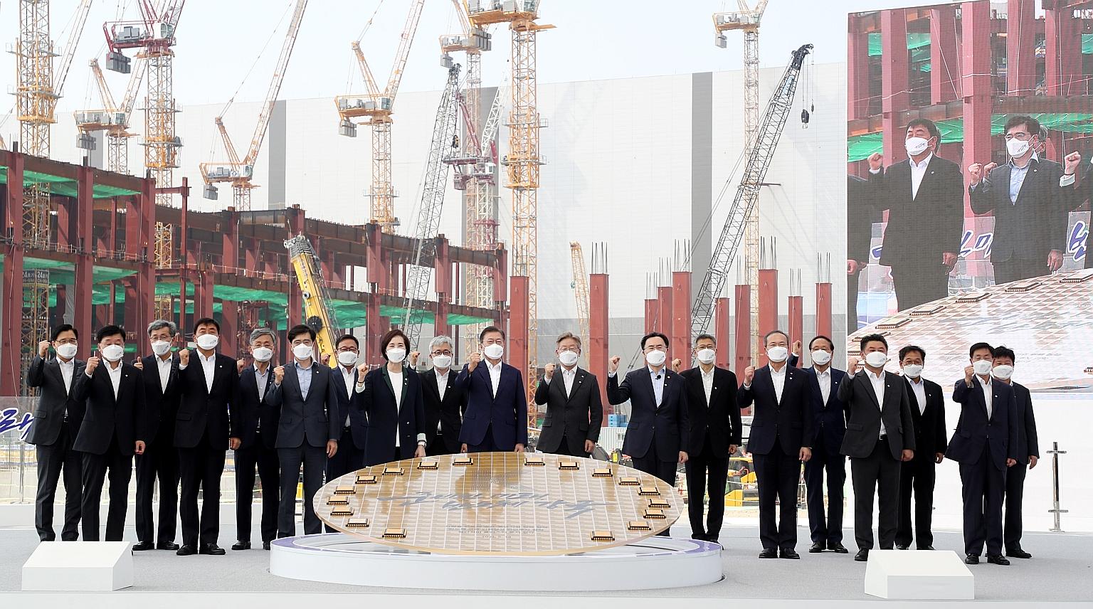 South Korean President Moon Jae-in (centre) during a visit to a Samsung plant in Pyeongtaek yesterday. Samsung and SK Hynix will lead the push of investment in semiconductor research and production in the next decade.