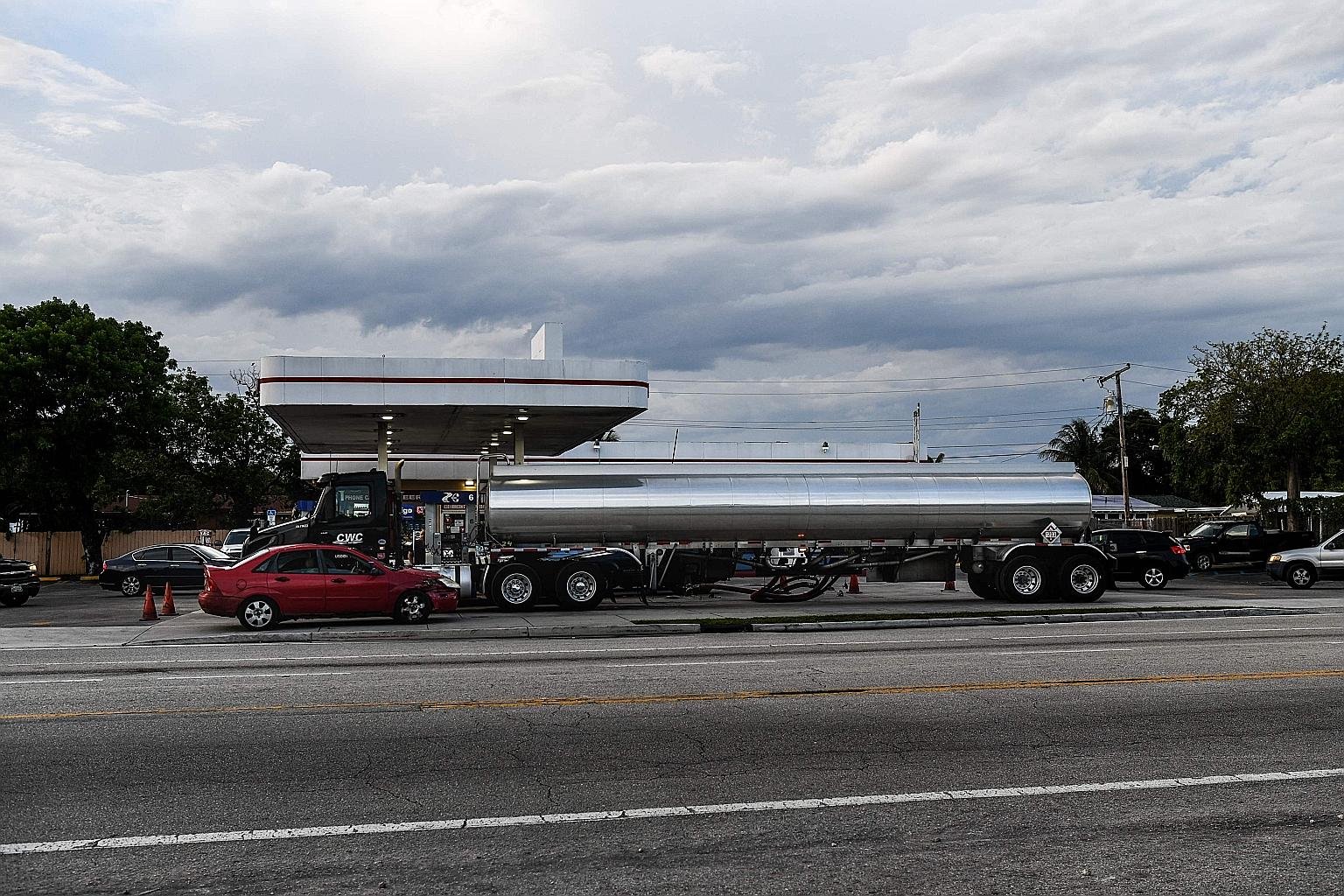 A tanker filling petrol at a station in Hollywood. Colonial Pipeline on Wednesday announced a gradual return to operations at its fuel pipeline following a five-day shutdown after a cyber attack. It would take several days for product delivery to ret