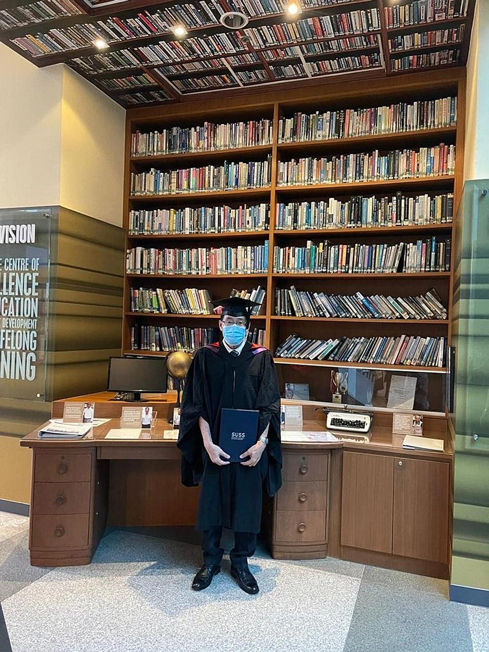 Traditional Chinese medicine physician Aw Yong Keong Poh graduated with a bachelor's degree in Chinese language and literature from the Singapore University of Social Sciences on May 4. PHOTO: COURTESY OF AW YONG KEONG POH