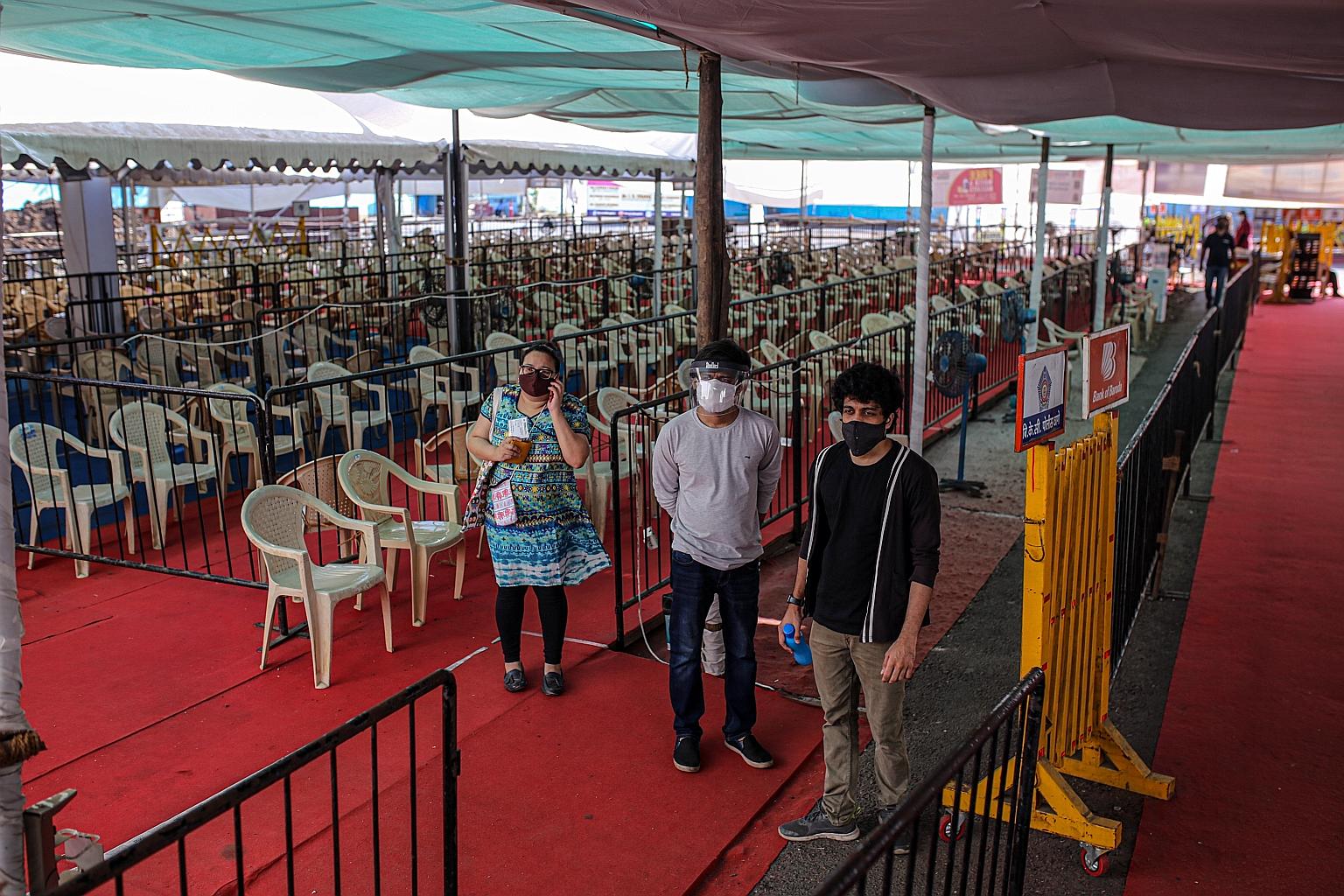 People at the waiting area of a Covid-19 vaccination centre in the Bombay Kurla Complex in Mumbai on Wednesday. India needs to vaccinate 70 per cent of its population to achieve herd immunity, but 117 days after its Covid-19 vaccination programme beg