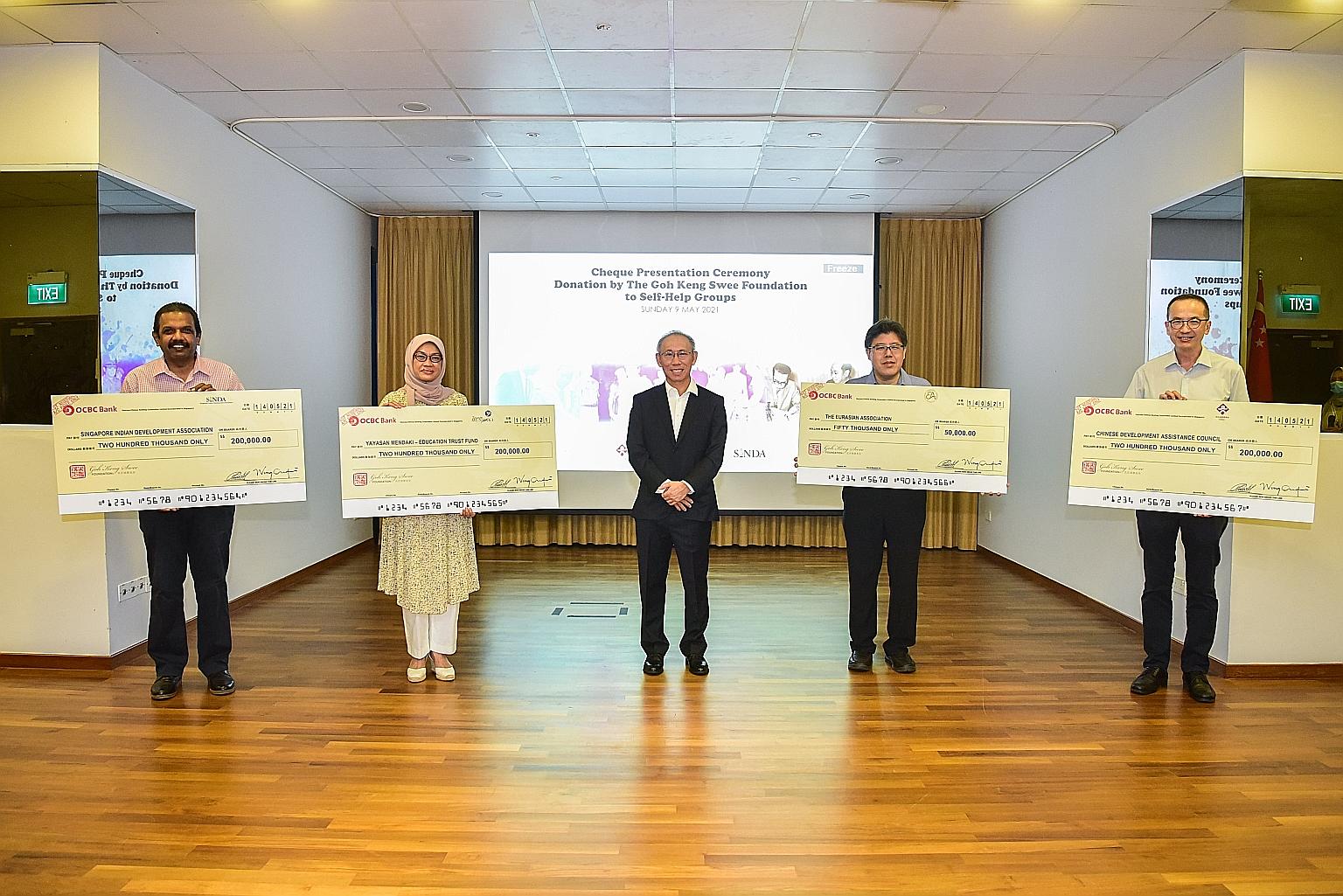 Goh Keng Swee Foundation director Wong Kok Hoi (centre) with key representatives of the four self-help groups - (from left) Sinda chief executive officer Anbarasu Rajendran, Yayasan Mendaki CEO Zuraidah Abdullah, Eurasian Association president Alexiu