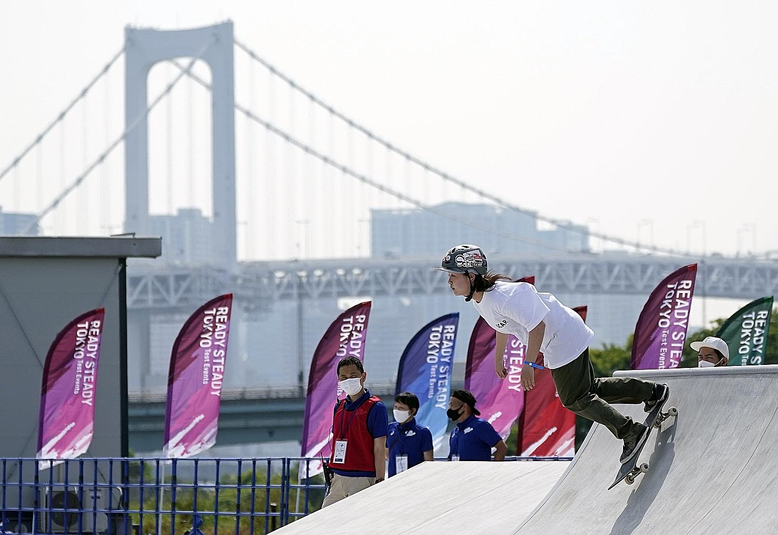 Azumi Fujieda, 14, competing at a women's street skateboarding test event at the Ariake Urban Sports Park in Tokyo yesterday. The sport will make its Olympic debut.