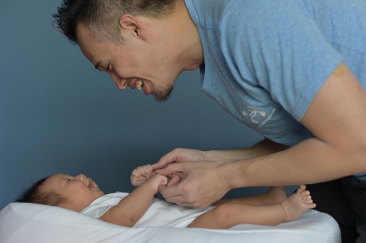 Currently, fathers get two weeks' paid paternity leave, while mothers get four months. This reinforces the idea that raising children is primarily women's work, said women's rights activist Corinna Lim. ST FILE PHOTO