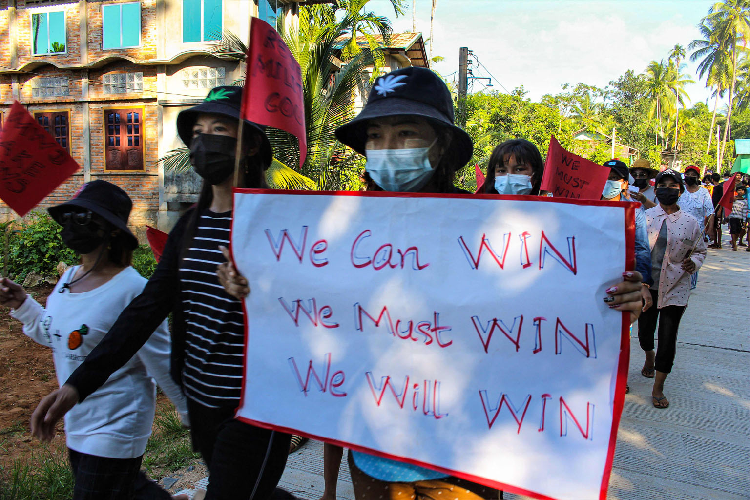 Anti-coup protesters holding signs and flags during a demonstration against the military coup in Dawei, Myanmar, in this handout photograph from Dawei Watch yesterday.
