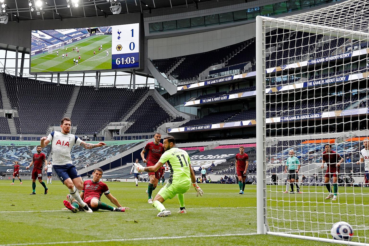 Spurs' Danish midfielder Pierre-Emile Hojbjerg slotting home their second goal in the 2-0 Premier League win over Wolves. But it came too late to revive any realistic chances of Champions League football.