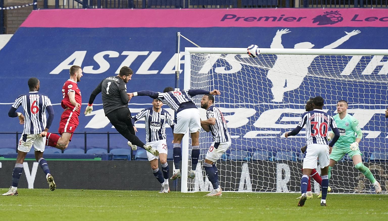Liverpool's Brazilian goalkeeper Alisson pops up at the other end of the field deep in stoppage time to head home and give them a priceless 2-1 win over relegated West Brom. The Reds will confirm a Champions League spot for the fifth year running if 