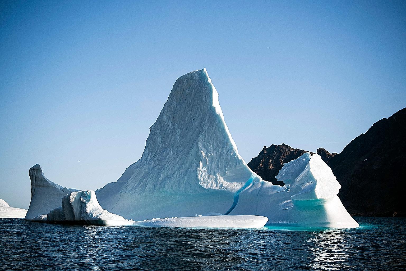A 2019 photo of an iceberg near the island of Kulusuk in Greenland. The country's ice sheet - the world's second largest after that in the Antarctic - is estimated to contain enough water to raise the average sea level by more than 7m. PHOTO: AGENCE 