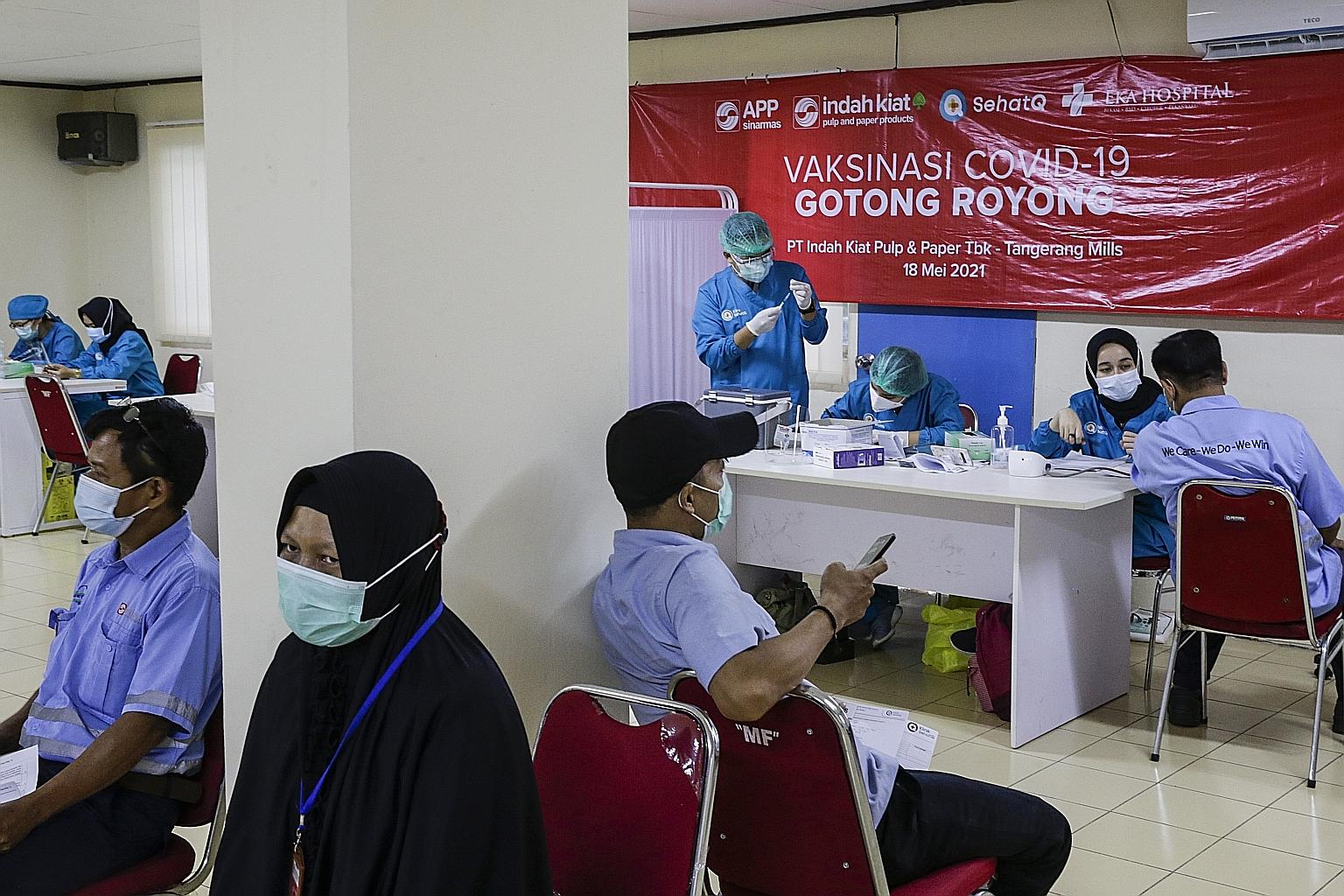 Workers at a Sinar Mas Group company in Jakarta waiting for their Sinopharm vaccines yesterday.