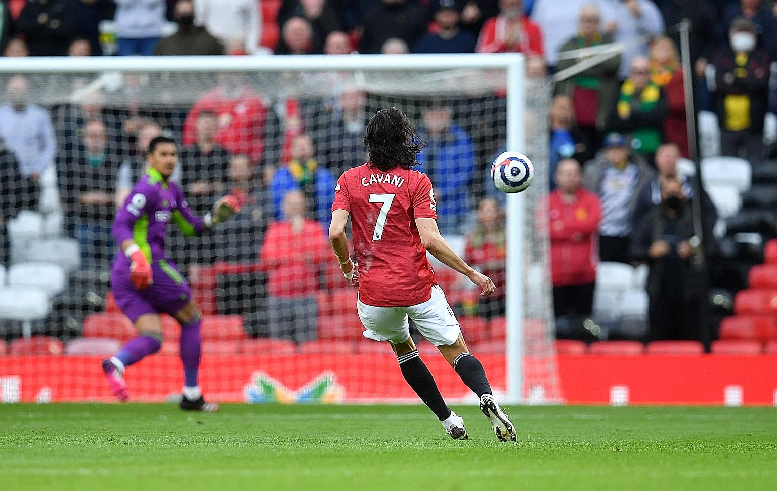 Manchester United striker Edinson Cavani scoring an audacious long-range lob in the 1-1 Premier League draw with Fulham on Tuesday. The Red Devils have sealed second spot.