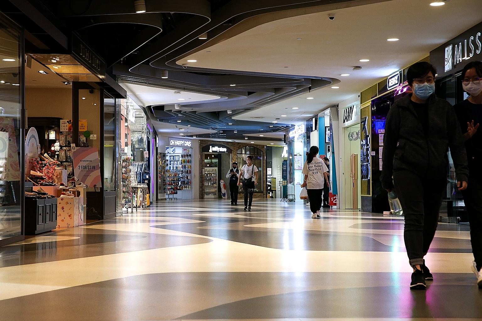 A near empty walkway in Bugis+ mall on Wednesday. A poll by the 700-member Singapore Tenants United For Fairness found that more than 81 per cent of retail, F&B and service businesses saw sales fall by more than 50 per cent on May 16, when the latest