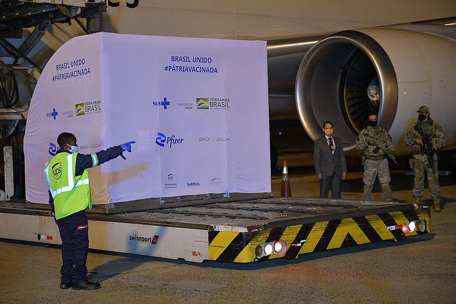 Workers unloading a container with a million doses of the Pfizer-BioNTech Covid-19 vaccine from a plane at Viracopos International Airport in Brazil last month.