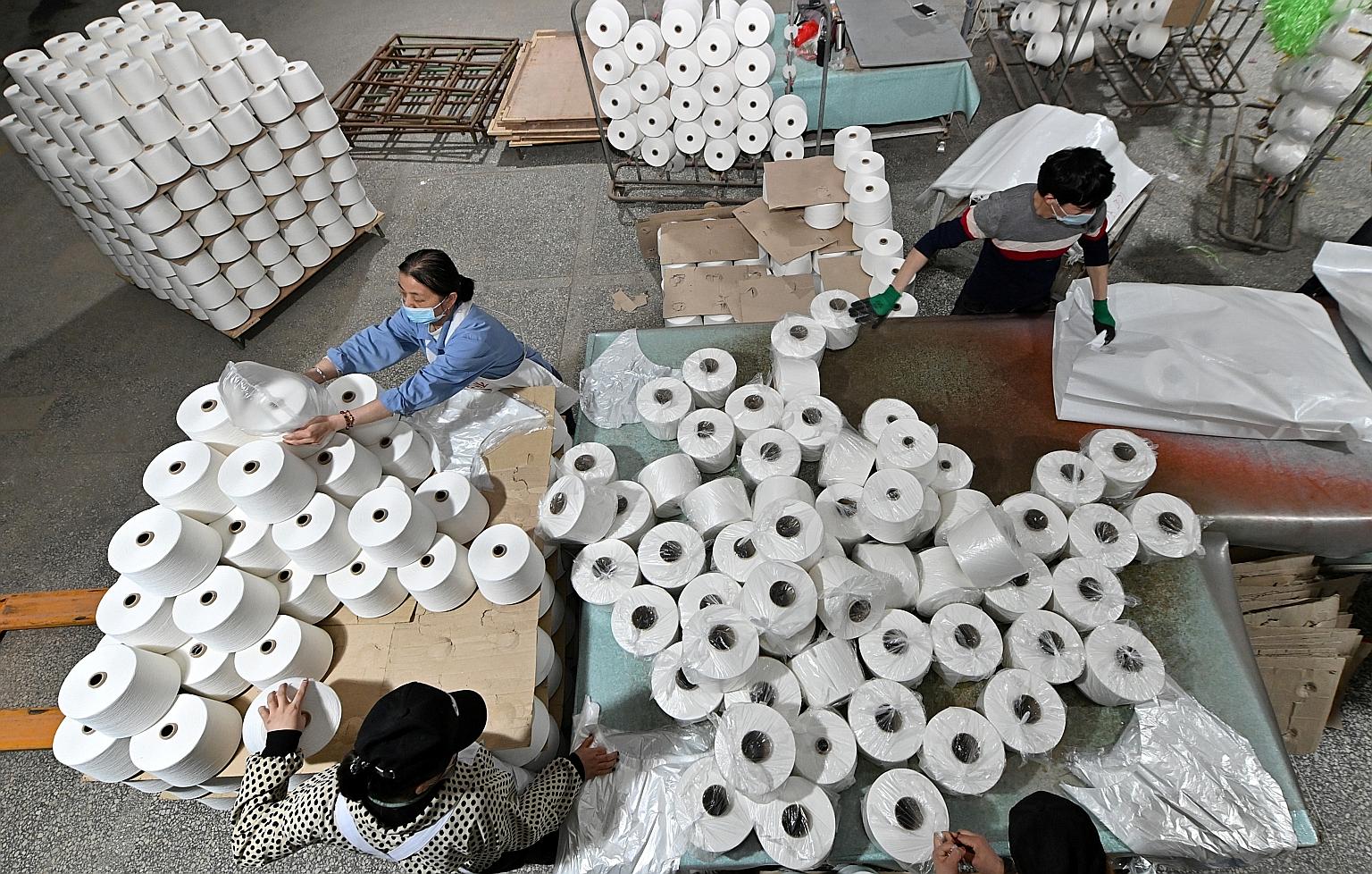 Workers at a cotton textile factory in Xinjiang's Korla city last month. The US Customs and Border Protection agency said Uniqlo failed to provide enough information to prove that the men's shirts in the shipment that was blocked were not produced in