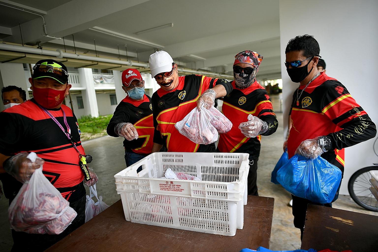 Volunteers collecting packets of korban meat for distribution to Muslim residents last August. Over 100 homes received the meat from about 2,940 sheep sacrificed in Australia.