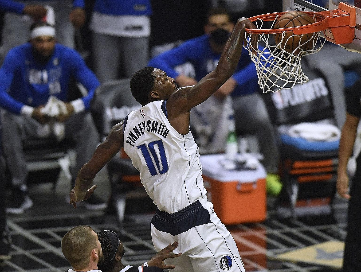 Dorian Finney-Smith of the Dallas Mavericks dunks on the Los Angeles Clippers as the visitors won 113-103 in Game 1 of the Western Conference first-round series on Saturday.