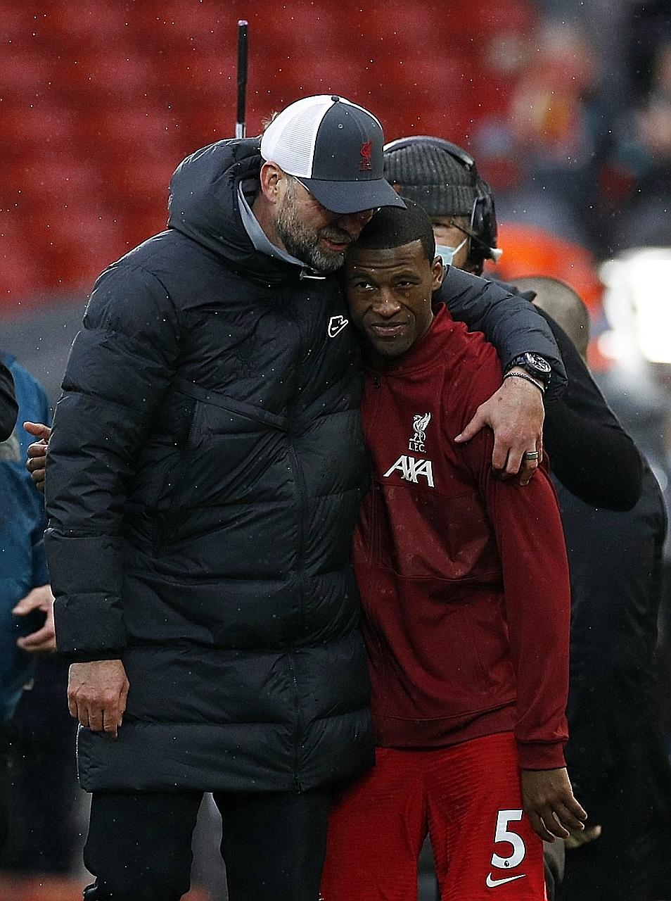 Manager Jurgen Klopp hugging Georginio Wijnaldum after Liverpool's 2-0 Premier League win over Crystal Palace at Anfield on Sunday. The emotional Netherlands midfielder came off to a standing ovation in his final Reds game. PHOTO: AGENCE FRANCE-PRESS
