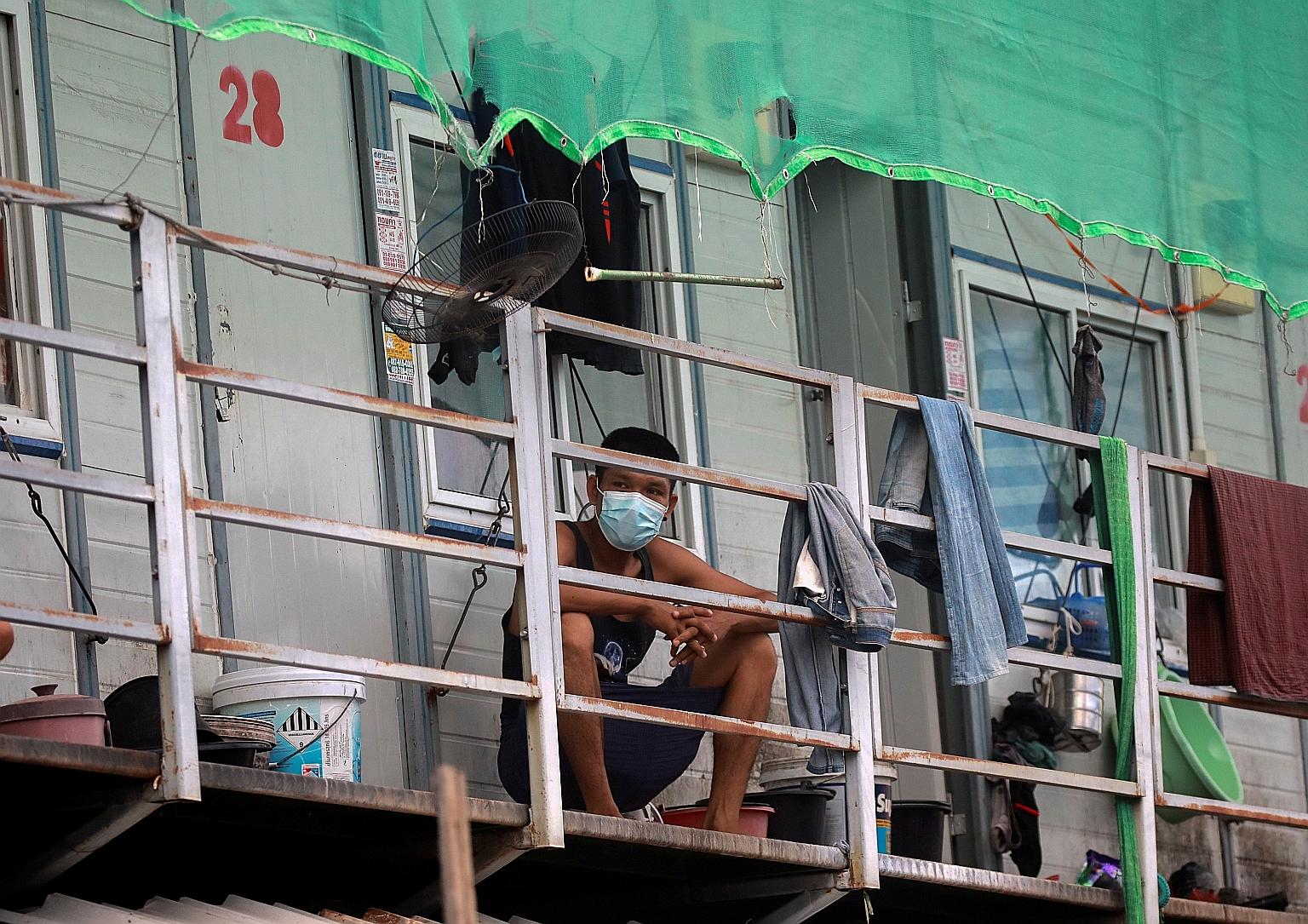 A Myanmar migrant worker keeping to his quarters where he has been stuck in for 12 days due to lockdown curbs, after clusters of Covid-19 cases were detected among construction workers in Bangkok.