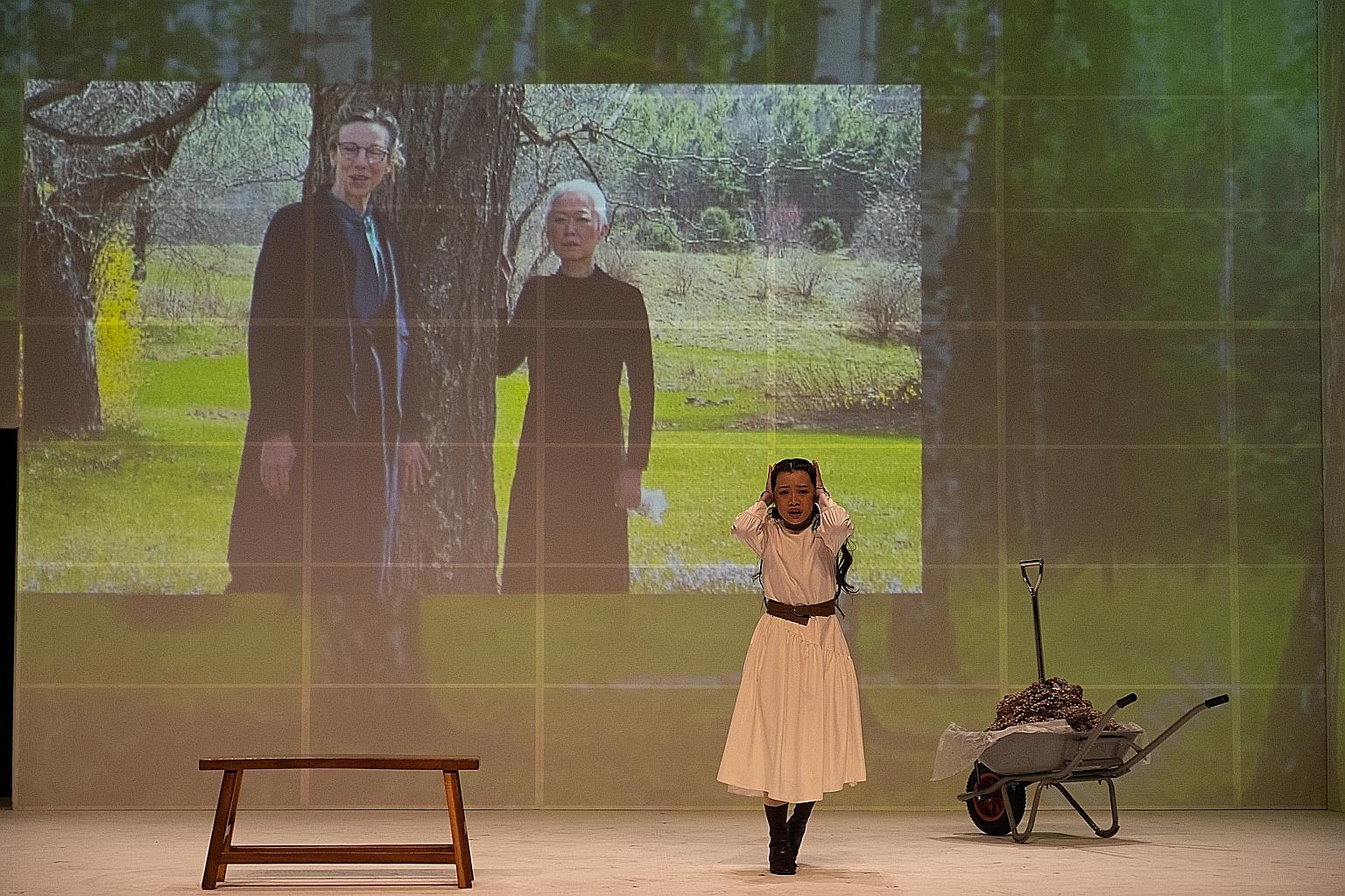 Three Sisters (above) sees Nine Years Theatre's ensemble on Drama Centre's stage physically, while Siti members loom over them in cinematic projections.