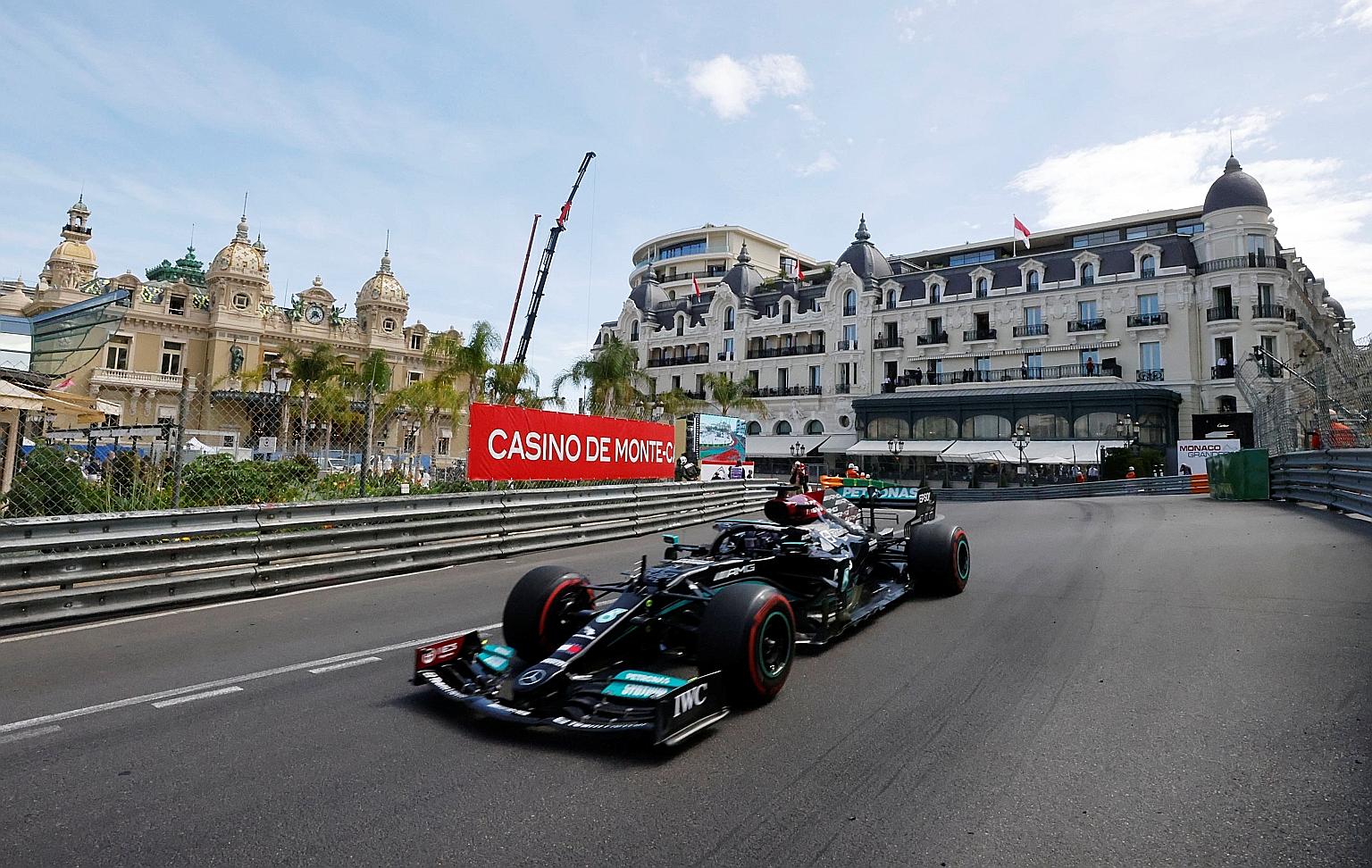 Lewis Hamilton driving past the Monte Carlo Casino and the Hotel de Paris during Sunday's Monaco Grand Prix, where he finished seventh and conceded the championship lead to Red Bull's Max Verstappen.