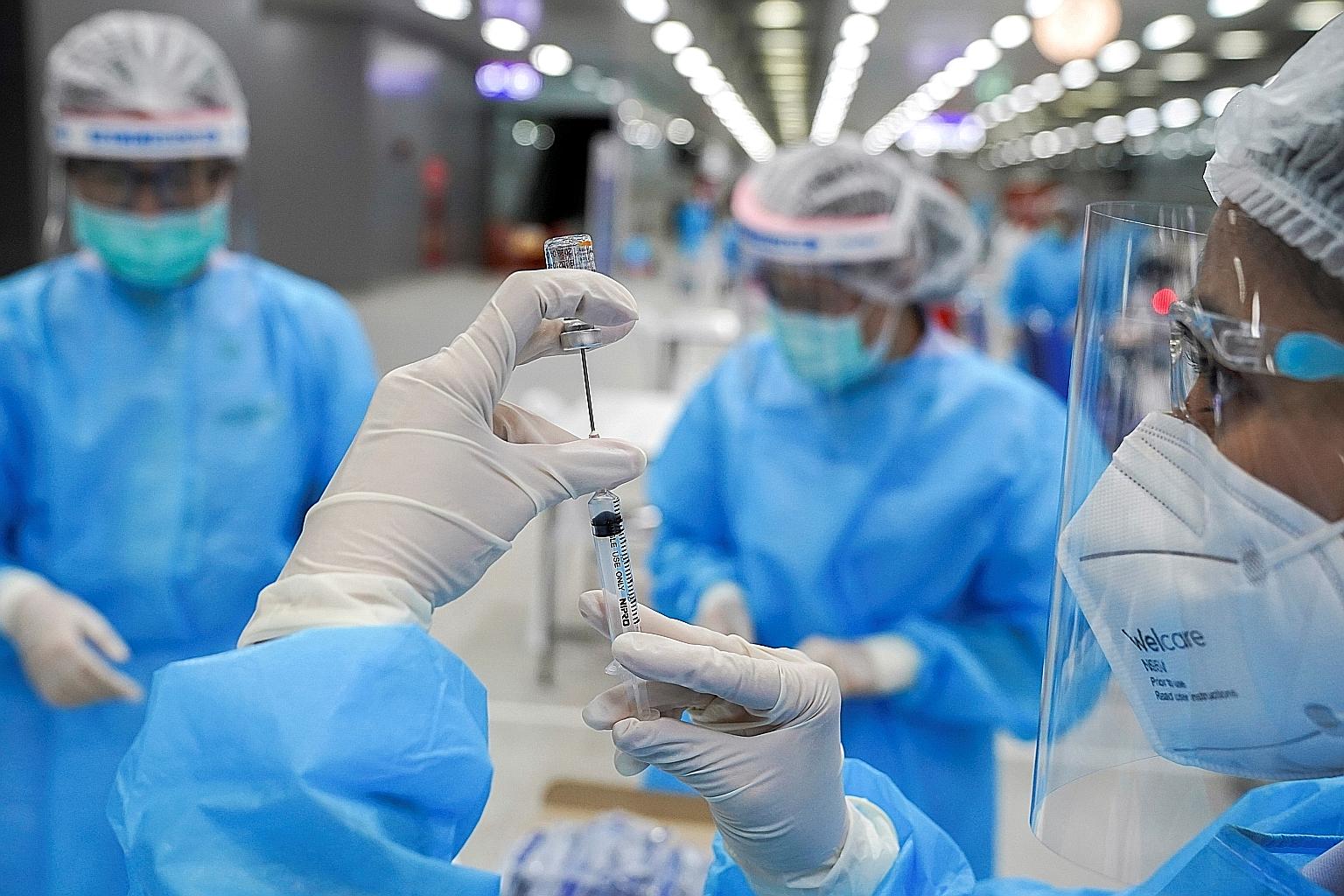 A medical worker preparing a dose of China's Sinovac vaccine at the Central Vaccination Centre, inside the Bang Sue Grand Station, in Bangkok, on Monday. Thailand's main vaccination drive will start on June 7. PHOTO: REUTERS